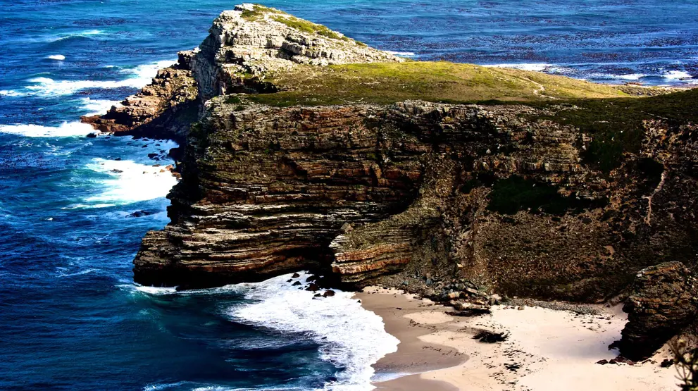 På spissen av klippene og de enorme viddene ligger Cape Point og Cape of Good Hope